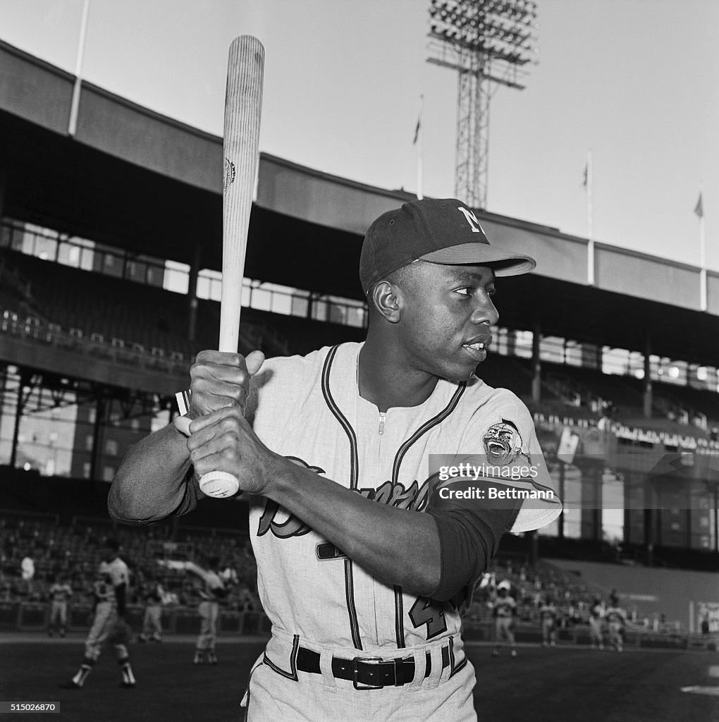 Hank Aaron Holding Baseball Bat