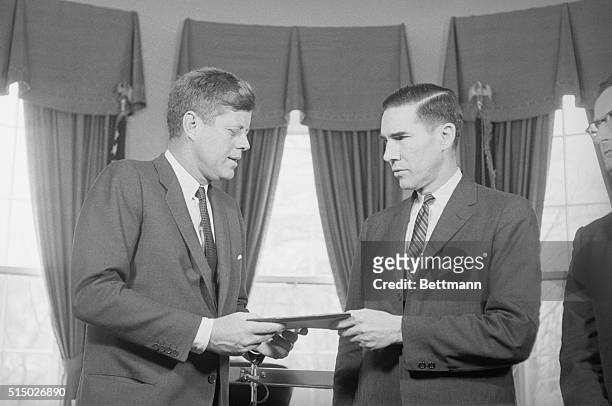 President John F. Kennedy with Alexander Heard, Chairperson of the Presidents Commission on Campaign Costs.