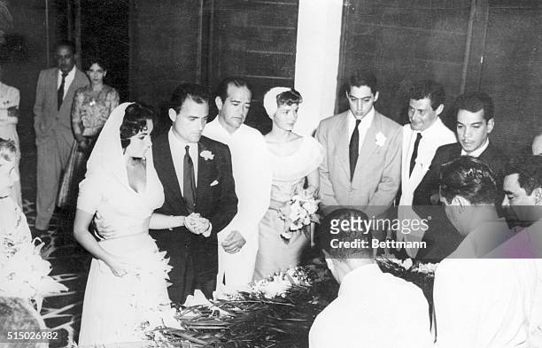 Acapulco, Mexico: Movie actress Elizabeth Taylor and film producer Mike Todd were married here tonight in simple civil ceremony attended by small...