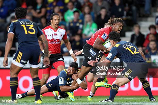 Howard Mnisi of the Lions on the attack during the round three Super Rugby match between the Highlanders and the Lions at Rugby Park on March 12,...