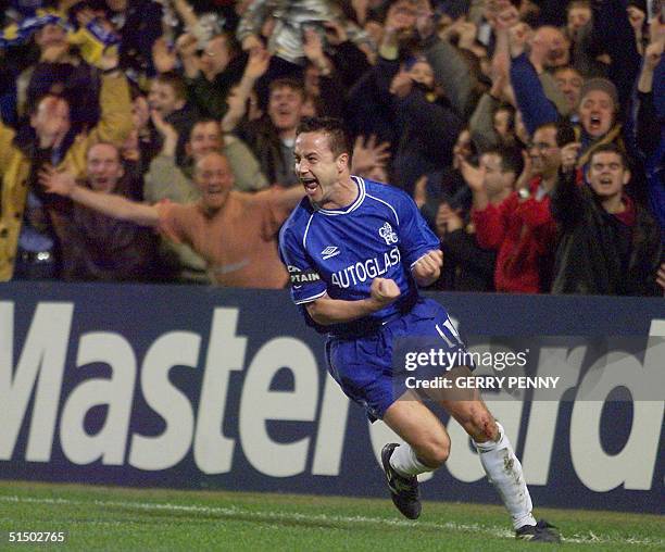Chelsea's midfielder and captain Dennis Wise celebrates after scoring the first goal against Marseille 08 March 2000, during their UEFA Champions...