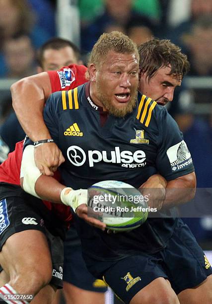 Siosiua Halanukonuka of the Highlanders looks to off-load the ball during the round three Super Rugby match between the Highlanders and the Lions at...