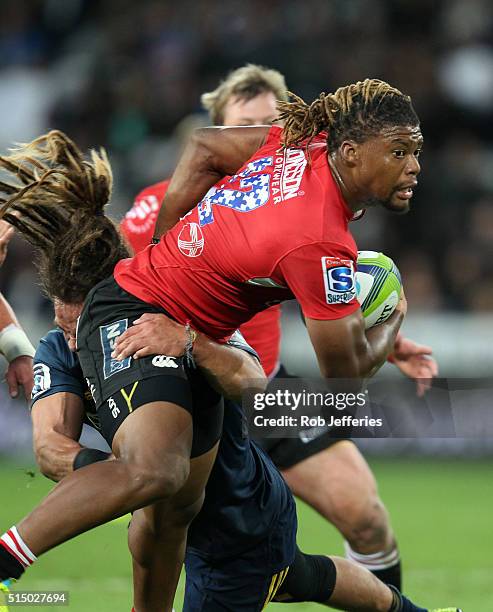 Howard Mnisi of the Lions looks to off-load during the round three Super Rugby match between the Highlanders and the Lions at Rugby Park on March 12,...