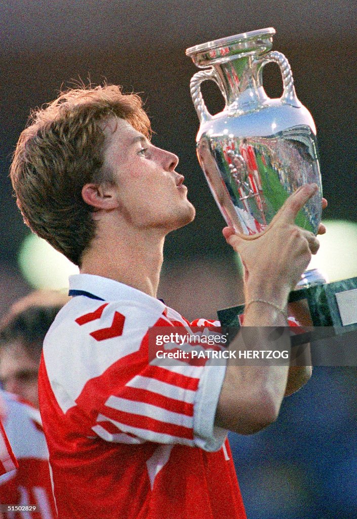 Danish forward Brian Laudrup kisses the Cup after