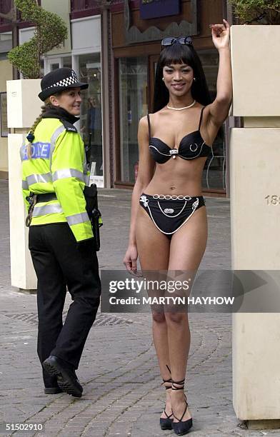 Susan Sangster , a Naomi Campbell lookalike, models a diamond encrusted bikini, possible the most expensive in the world, prior to taking her place...