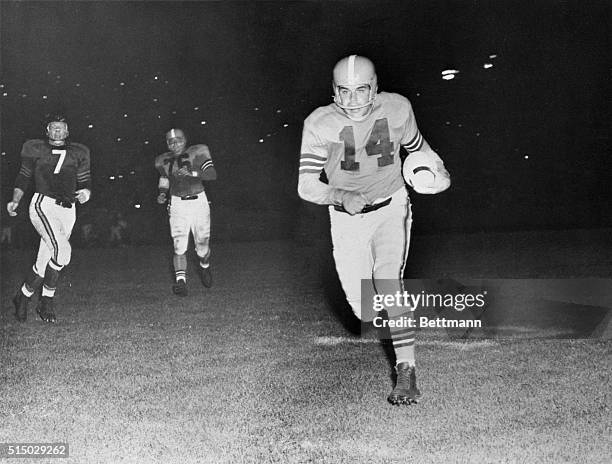 Otto Graham Cleveland Brown quarter back scoring a touchdown in the 2nd quarter as Ed Sprinkle Chicago Bears, tries unsuccessfully to catch Graham....