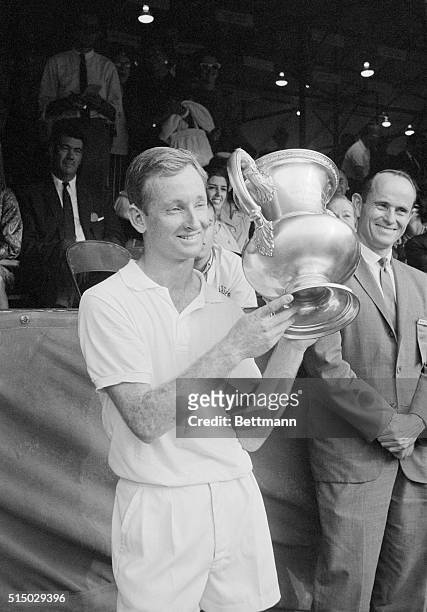 Rod Lavers, of Australia, displays his trophy September 10th, after winning the U.S. National men's singles title. Playing against fellow countryman...