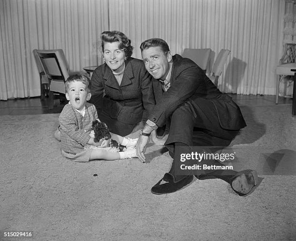 Patricia Kennedy, daughter of U.S. Ambassador to England Joseph Kennedy, is married to actor Peter Lawford. Here they are in their Los Angeles home...