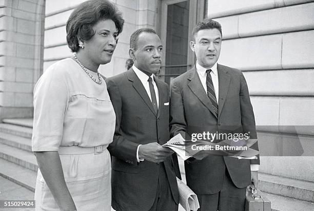 James Meredith , and his attorneys, Mrs. Constance Motley , and Jack Greenberg , paused briefly to talk with reporters in front of the Federal Courts...