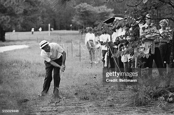 William J. Patton of Morganton, NC wears a look of surprise as he chips his ball on the fairway after having hit in the rough during opening day play...