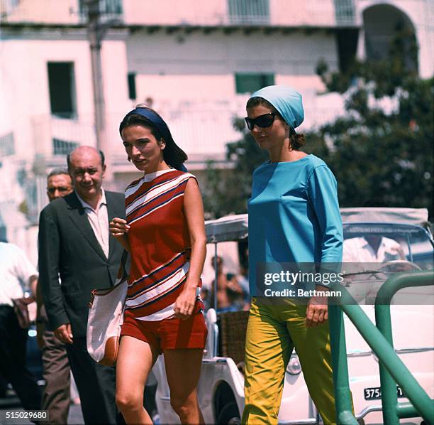 First Lady Jackie Kennedy with her sister, Lee Radziwill, at Amalfi harbour before a motorboat excursion to Conca dei Marini beach in Campania,...