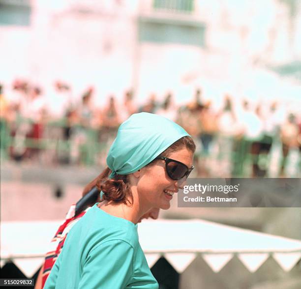 Jackie Kennedy is shown at the Pier of Amalfi, en route to Conca dei Marini beach via motorboat and then back from Amalfi to Ravello Villa.