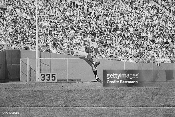 Ed "Whitey" Ford of the New York Yankees pitching during their first game of the World Series against the San Francisco Giants at Candlestick Park....