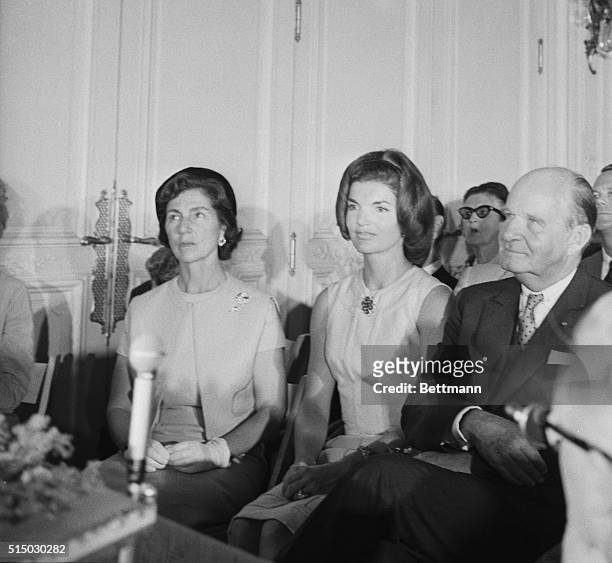 Mrs. Jacqueline Kennedy sits with her mother, Mrs. Auchincloss and architects Edward Durrell Stone during ceremonies where a model of the proposed...