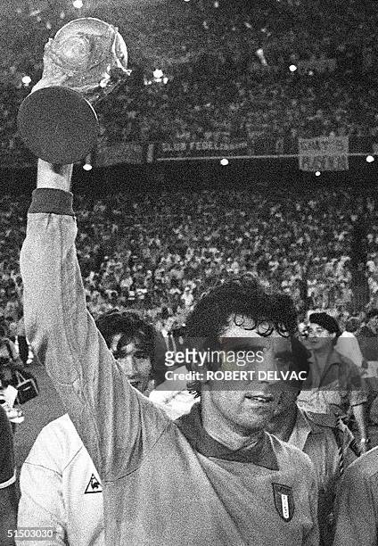Italian national soccer team captain and goalkeeper Dino Zoff brandishes the FIFA World Cup trophy after Italy defeated West Germany 3-1 in the World...