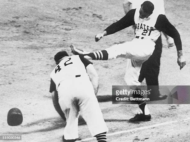 Pittsburgh Pirates right fielder Roberto Clemente kicks his cap after hitting into a double play in the first inning of the game against the Chicago...
