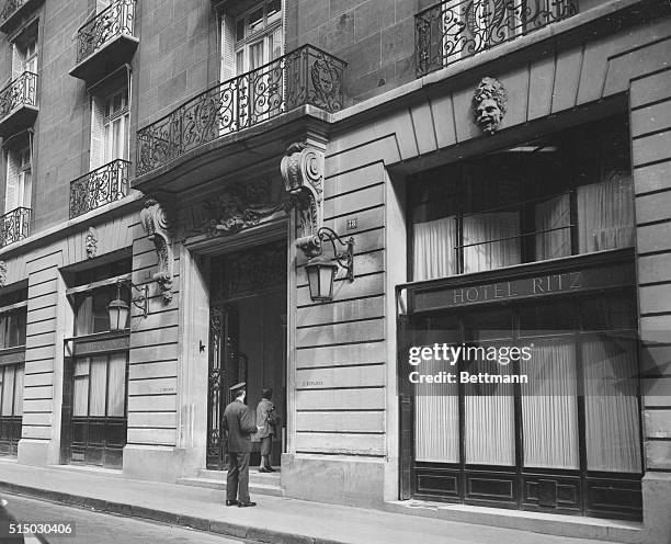 Paris, France: Ritz from Rue Cambon Pedestrians walking along the street and entrance to Grill Room and American Bar. Door man helping out with...