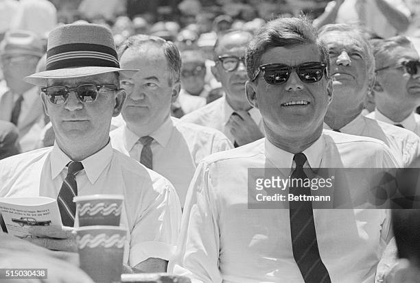 Washington: President Kennedy seems to be enjoying himself as he watches the 32nd All Star game in D.C. Stadium here.