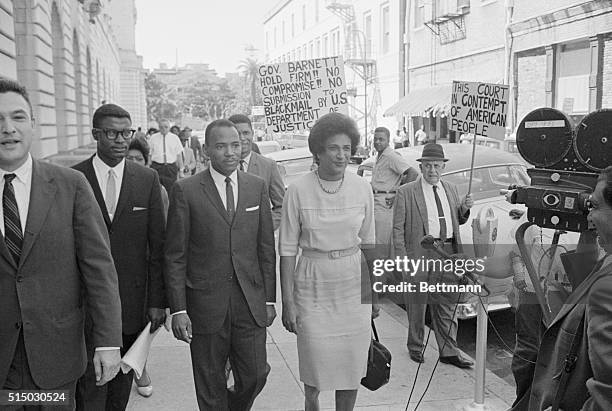 James Meredith, and his attorney Constance Motley, were followed by pickets when they left the Federal Courts Building September 28th during the noon...