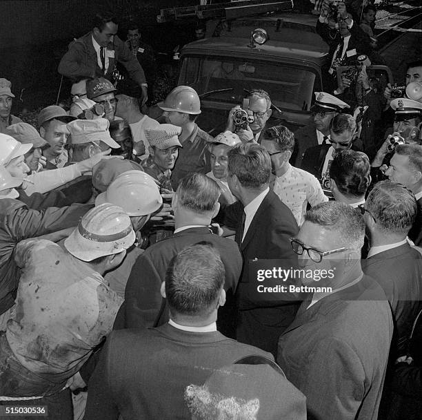 Monessesn, PA.: President Kennedy gets an all around welcome from hard-hatted steel workers while on his short visit here. The President is...
