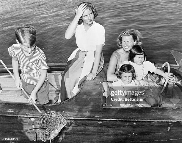 Ingrid and Children on Boat Outing. Santa Marinella, Italy: Actress Ingrid Bergman and her four children are enjoying a holiday at her seaside villa...