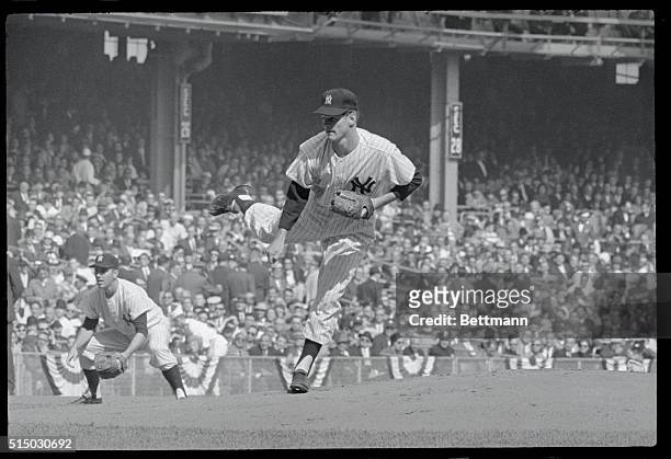 With Yankee sacker Clete Boyer in position, Ralph Terry delivers a pitch during first inning play of Game 5 of the 1962 World Series at Yankee...