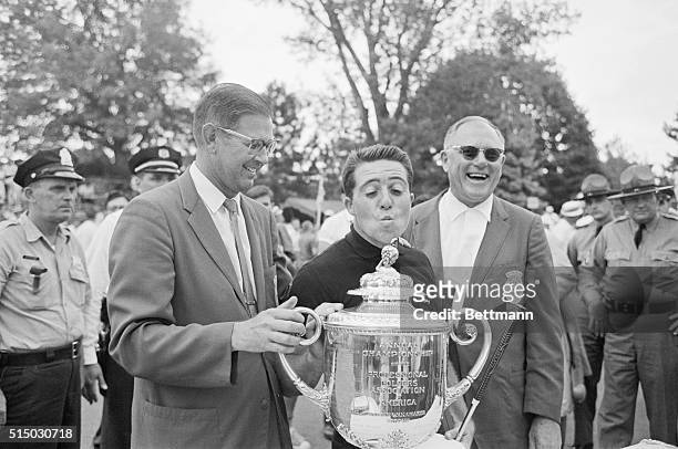Aronimink GC, Pennsylvania: Gary Player clowns as he's asked to "kiss the trophy", after winning the PGA Championship here, July 22.