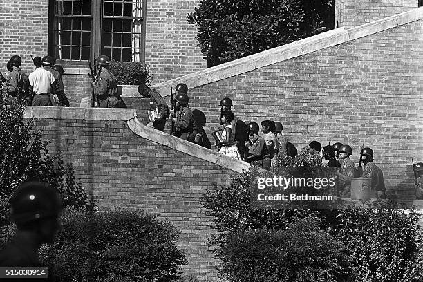 Negro students who had previously been barred from Little Rock Central High School, were provided with portal-to-portal protection in entering the...