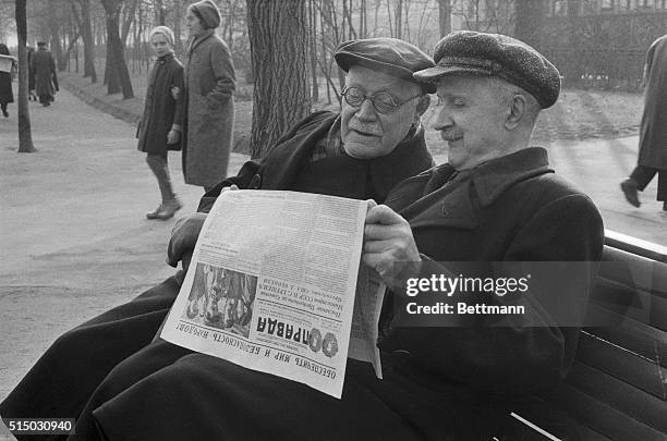 Two aged Russians read the October 29th morning edition of Pravda which headlines the exchange of messages on the Cuban crisis between Premier...