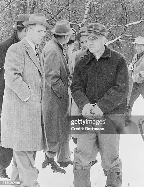 Plainsfield, Wisconsin: Edward Gein, 51-year-old farmer is surrounded by newsmen and officers on his 160-acre farm after discovery of the mutilated...