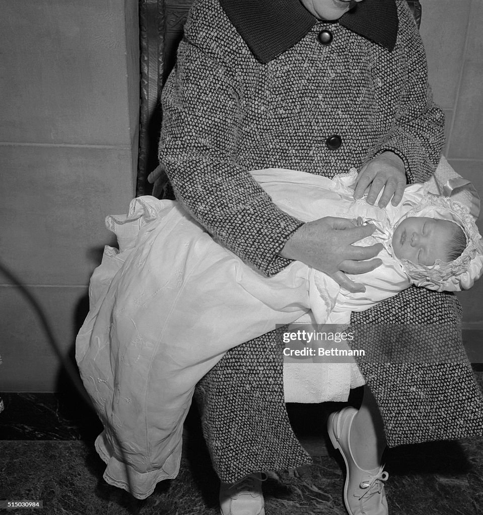 Caroline Kennedy Being Dressed in Baptismal Robes