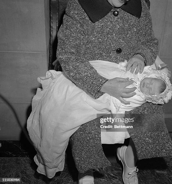 Close up of Caroline Bouvier Kennedy, daughter of Senator and Mrs. John F. Kennedy, in her baptismal robes as she was baptized at St. Patrick's...