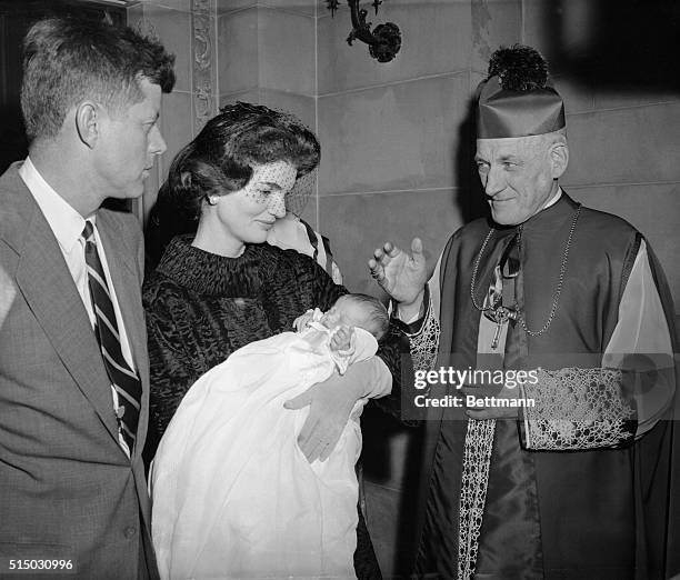 Archbishop Richard Cushing of Boston is giving his blessing to Caroline Bouvier Kennedy after the baby was baptized at St. Patrick's Cathedral today....