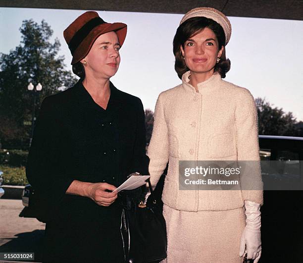 Jacqueline Bouvier Kennedy Onassis while attending a fashion show at the US State Department, the "Commonwealth Costume Cavalcade."