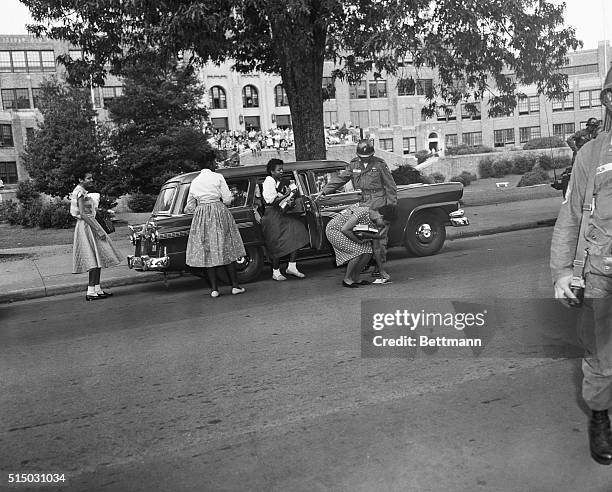Leaving the Army Vehicle that brought the nine black students to Little Rock Central high School this morning, Minnie Brown dropped a book. That was...