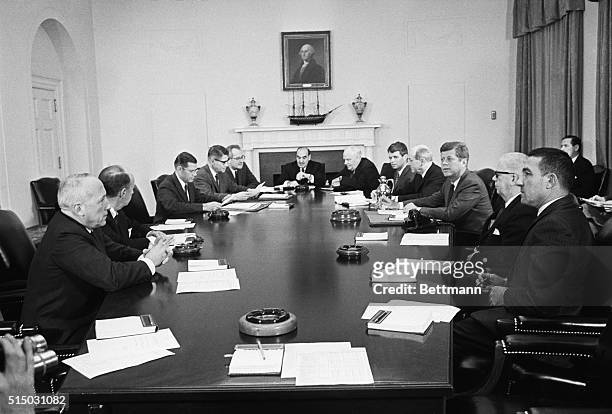 Cabinet Meeting. Washington: President Kennedy meets with his cabinet at the White House today. Left to right: Post Master General Edward Day; Adlai...