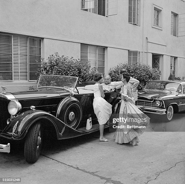 Burl Ives, who plays a cattle baron of the 1870's in The Big Country, looks like a present day Baron of industry sitting in his packard touring car ....