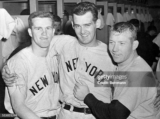 Yankee heroes congratulate each other in the dressing room after the Bombers routed the Milwaukee Braves 12-3 in the third World Series game. From...