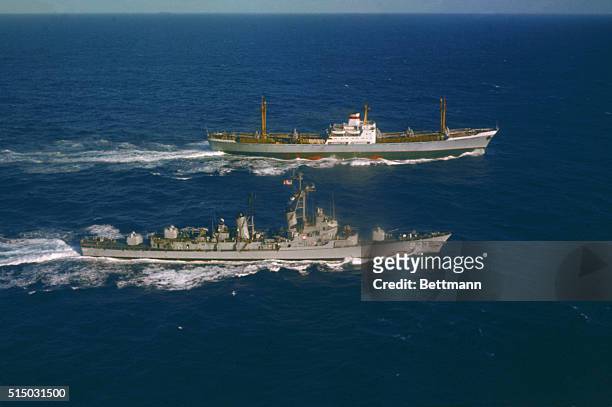 Off Puerto Rico: U. S. S. Barry Alongside Ansov. The U. S. S. Barry steams alongside the Soviet freighter Ansov, outbound from Cuba, for an...