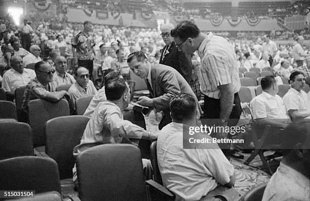 James R. Hoffa, candidate for the presidency of the Teamsters Union campaigns in the aisles in convention hall, Miami Beach, trying to get a nose...