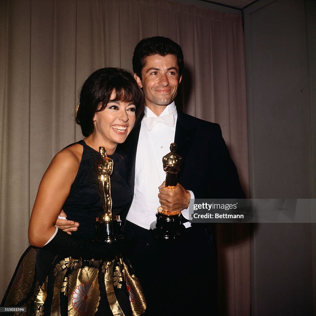 George Chakiris and Rita Moreno Holding "Oscars"