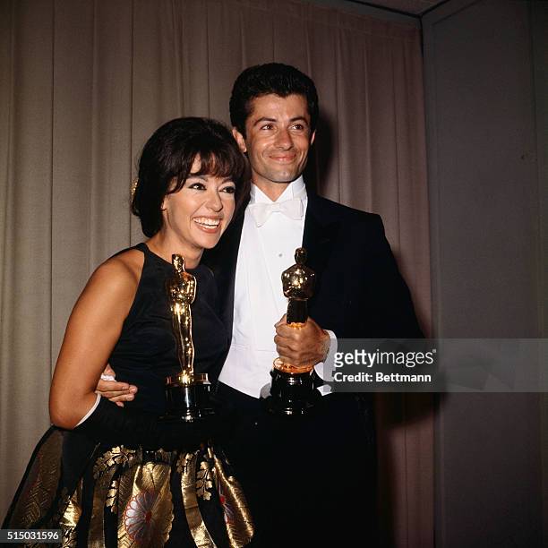 George Chakiris and Rita Moreno are shown here as they accept their Academy Awards.
