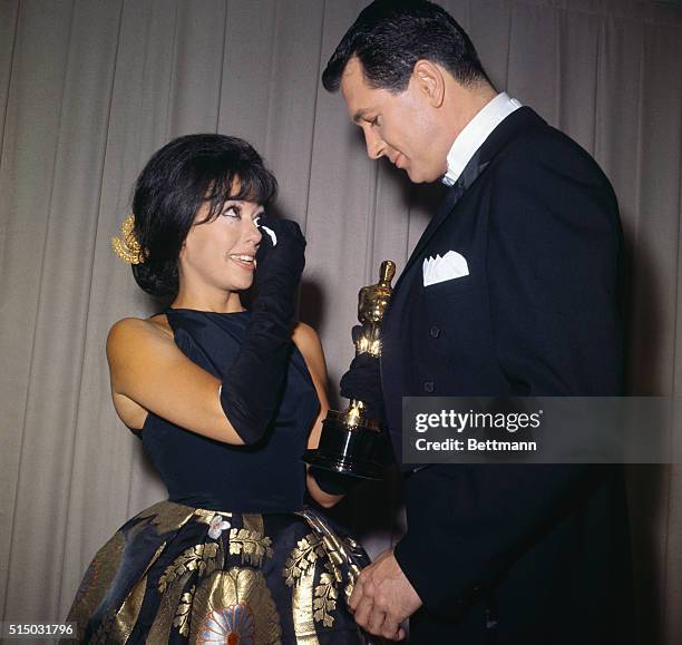 Rita Moreno tearfully accepts her Oscar for best supporting actress for her role in the 1961 film West Side Story at the 34th Academy Awards, held on...