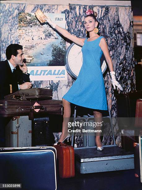 Florence, Italy: Baring the kneecaps in a shift of textured, turquoise jersey, Emilio Pucci advocates simplicity of line for Spring and Summer, 1962....
