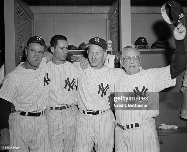 Heroes of the first game of the 1957 World Series pose in the Yankee dressing room after the Yankees beat the Milwaukee Braves in the curtain raiser...