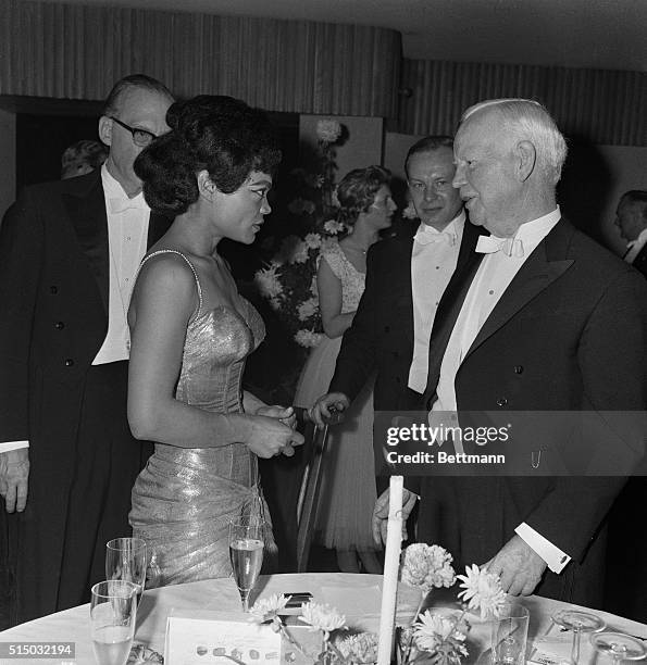 American entertainer Eartha Kitt chats with West German President Heinrich Luebke November 10 while attending the traditional German Parliamentary...