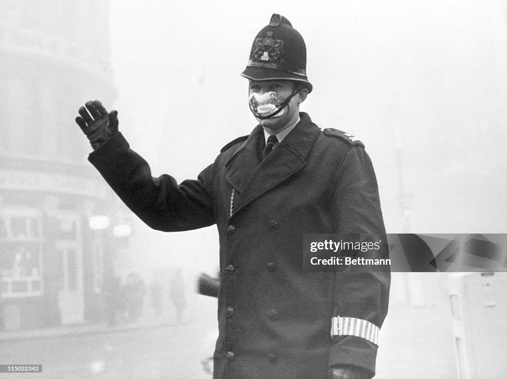 Police Constable with Protective Mask in Fog