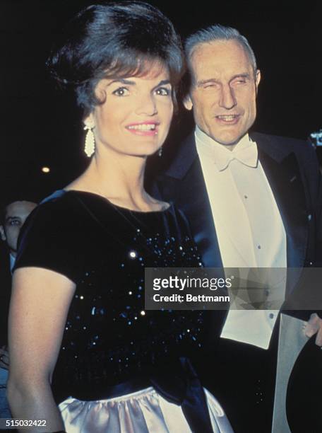 New York: Mrs. John F. Kennedy with John D. Rockefeller III, arrives at the opening of the New York Philharmonic at Lincoln Center.
