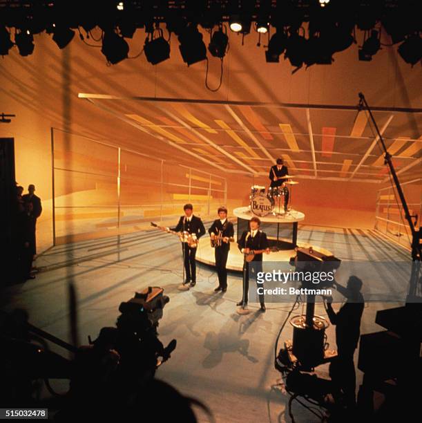 The Beatles performing during their nationwide television debut on The Ed Sullivan Show from CBS television studios in Manhattan.