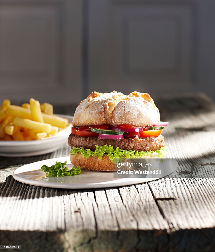 Hamburger on plate and french fries